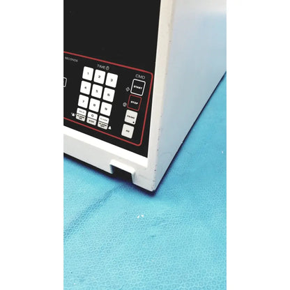 White microwave oven with black numeric keypad control panel from sorvall instruments cell washer 2 model 8603815