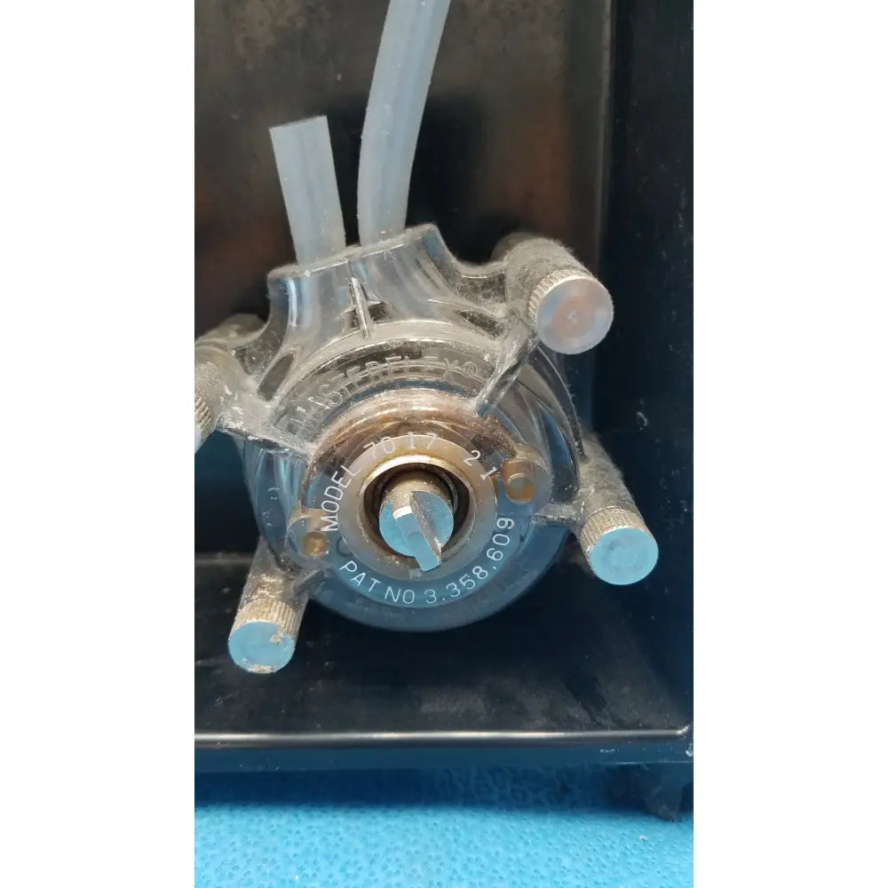 Clear plastic peristaltic pump with metallic fittings and blue-tinted knob for sorvall instruments cell washer 2