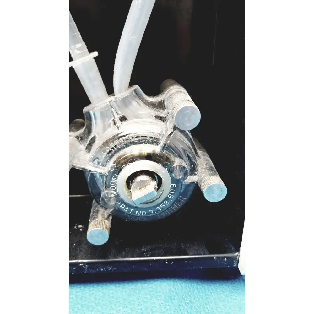 Clear plastic peristaltic pump with metallic fittings and blue tubing for Sorvall instruments cell washer 2