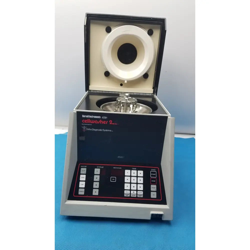 Sorvall instruments cell washer 2 centrifuge with gray and black body and white rotor chamber labeled orchid diagnostic systems