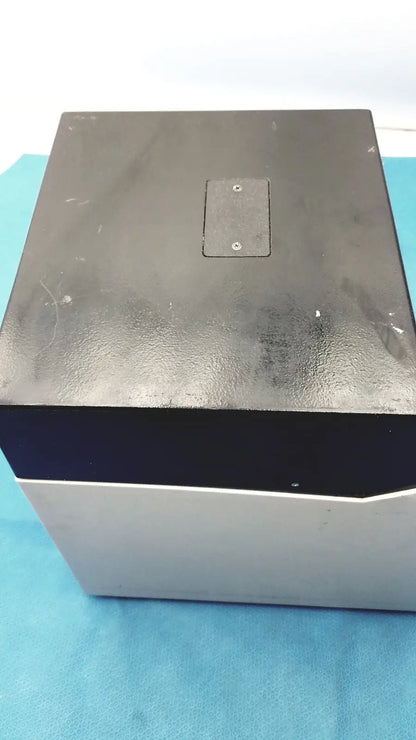 Black and silver rectangular sorvall instruments cell washer 2 with matte finish top panel and two screws visible