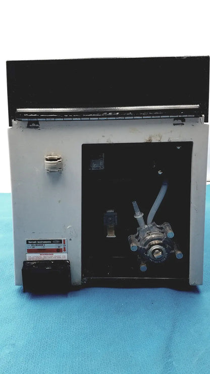 Gray metal sorvall instruments cell washer 2 with black top panel and visible tubing and valves internal components