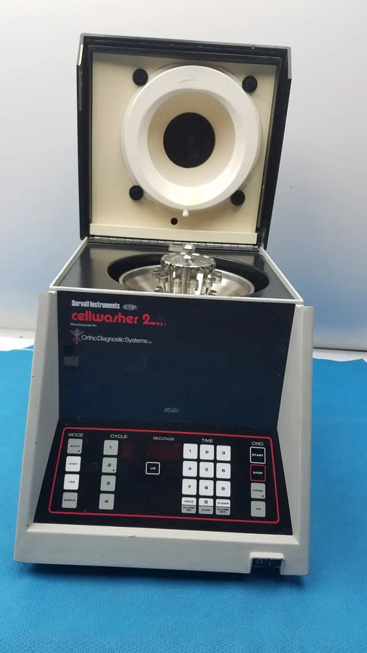 Sorvall instruments cell washer 2 centrifuge with gray and black body and white rotor chamber labeled orchid diagnostic systems