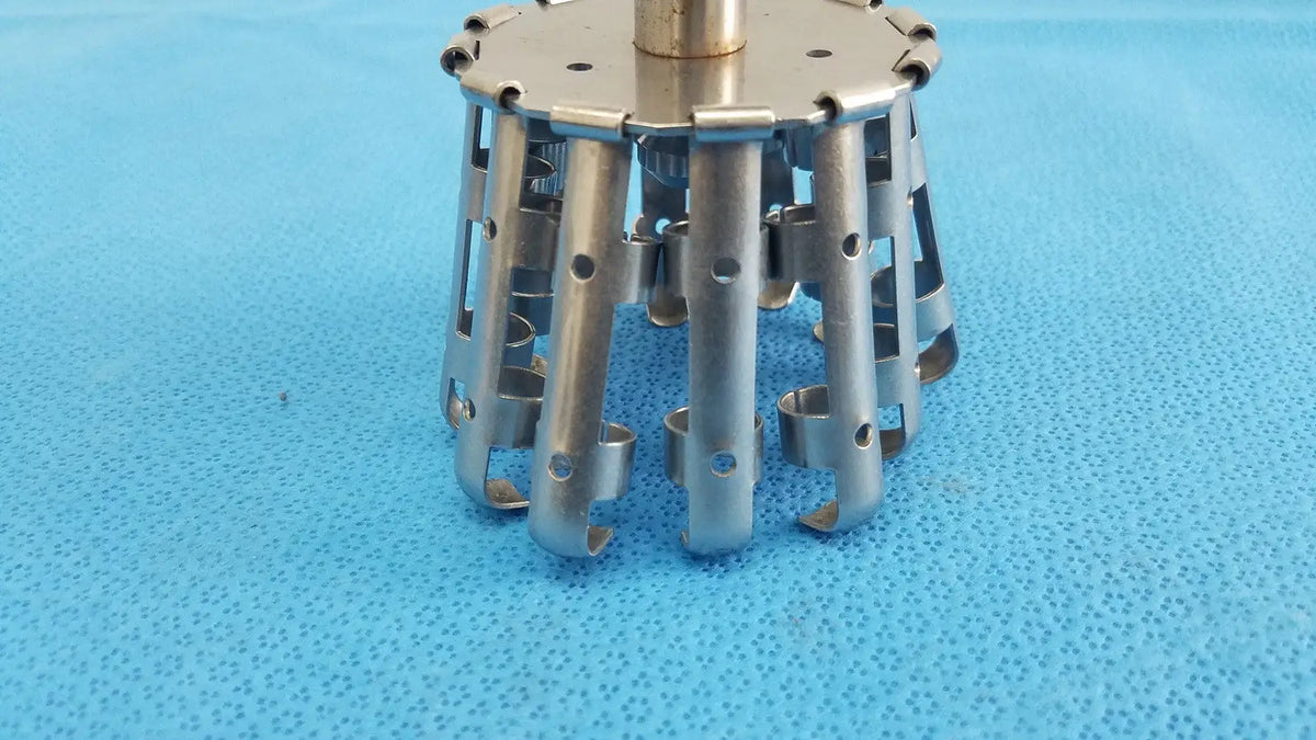 Silver metallic sorvall type-da-12 centrifuge rotor with cylindrical body and multiple articulated arms for lab use