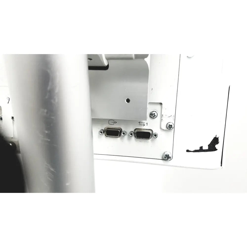 White plastic panel with two black d-sub connectors and silver screws on the back of spacelabs healthcare ultraview sl model patient monitor