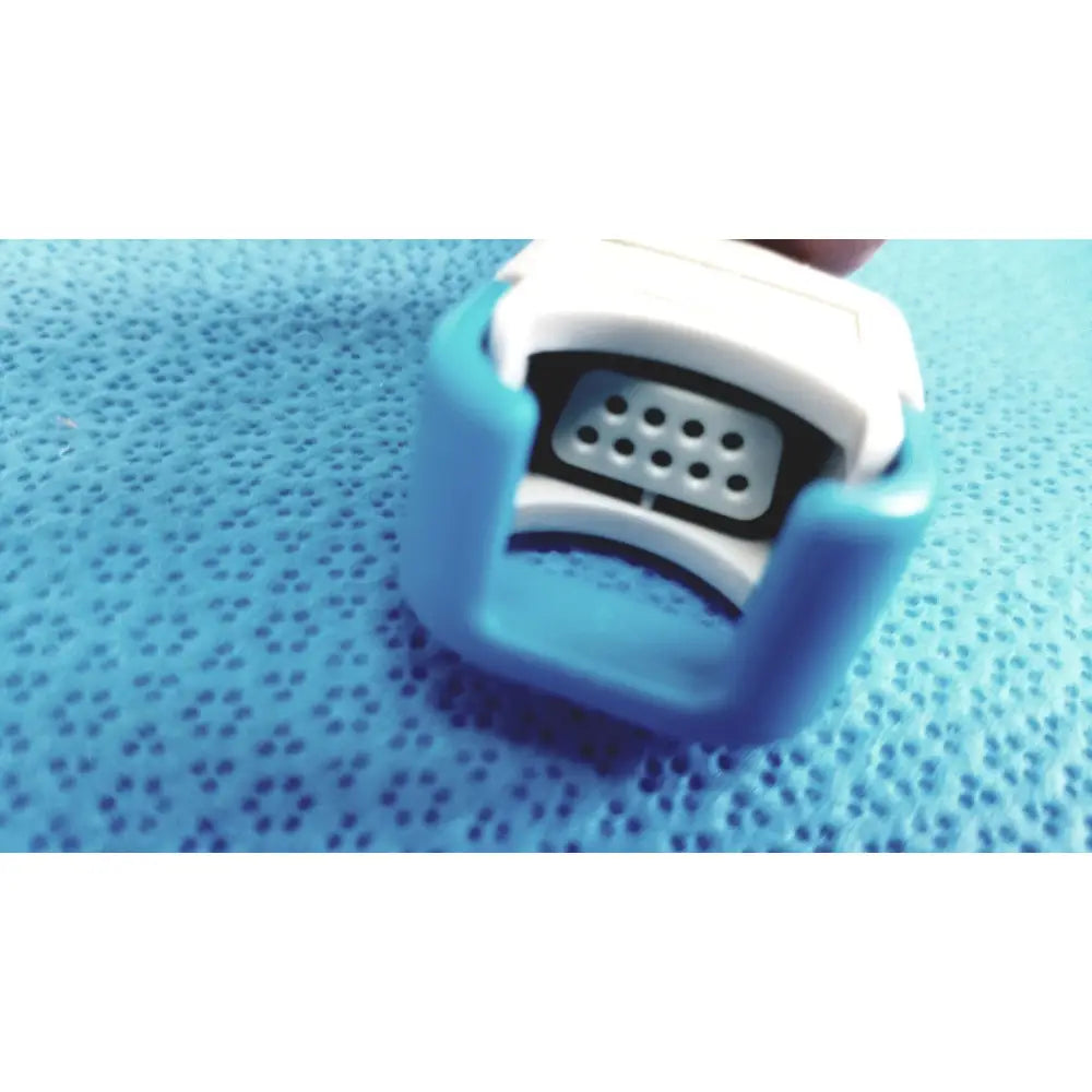 Blue and white plastic nasal dilator with perforated metal insert for spacelabs medical extension adapter cable 700-0030-00