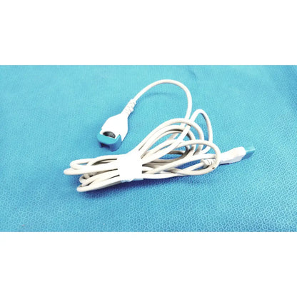 Spacelabs medical extension adapter cable 700-0030-00 white cable with teal connector and usb end coiled on blue surface