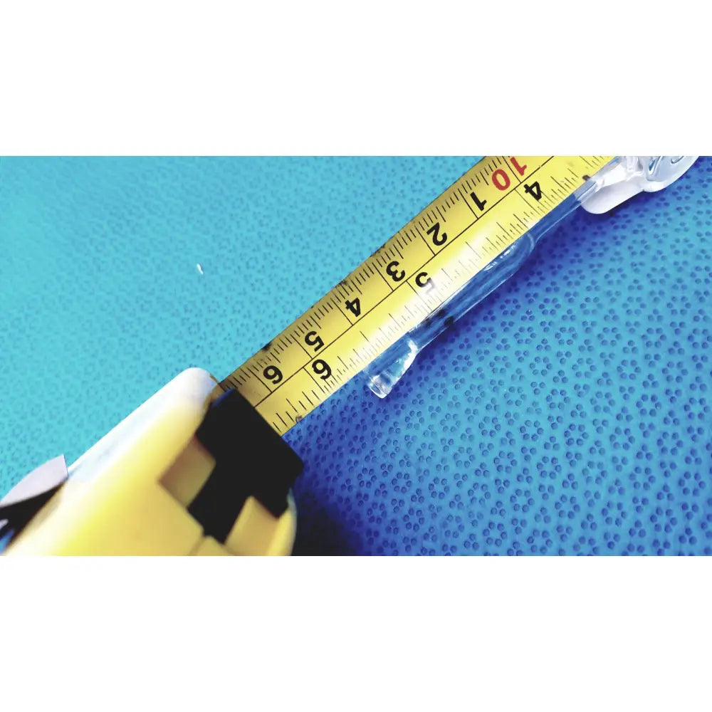 Yellow tape measure with black markings and white casing next to spherical joint glass stopcock valve for lab vacuum control