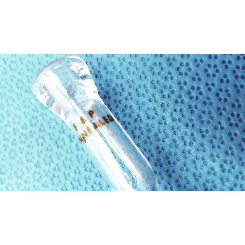 Clear glass test tube with gold-colored f.s.p. in borosilicate spherical joint glass stopcock valve adapter