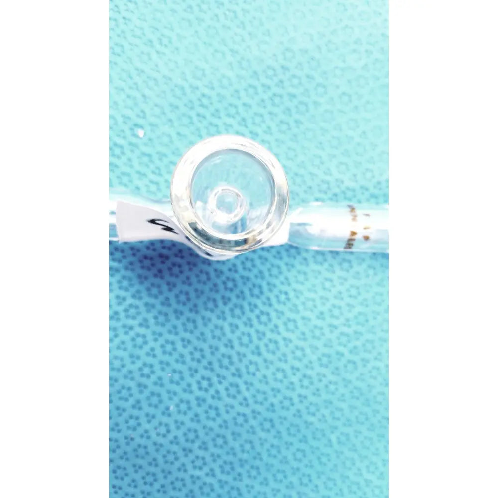 Clear glass spherical joint glass stopcock valve with rounded transparent cap and printed labeling for lab vacuum use