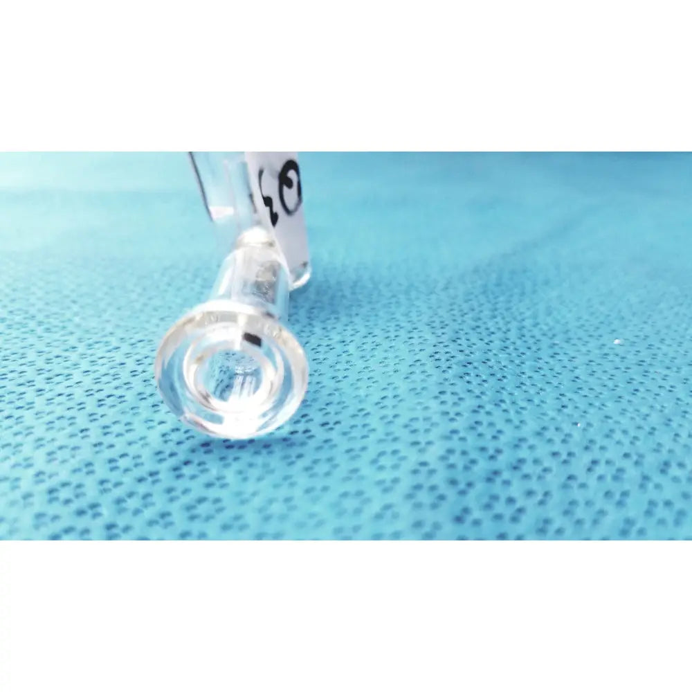Clear glass spherical joint glass stopcock valve with smooth rounded base and cylindrical stem made of borosilicate