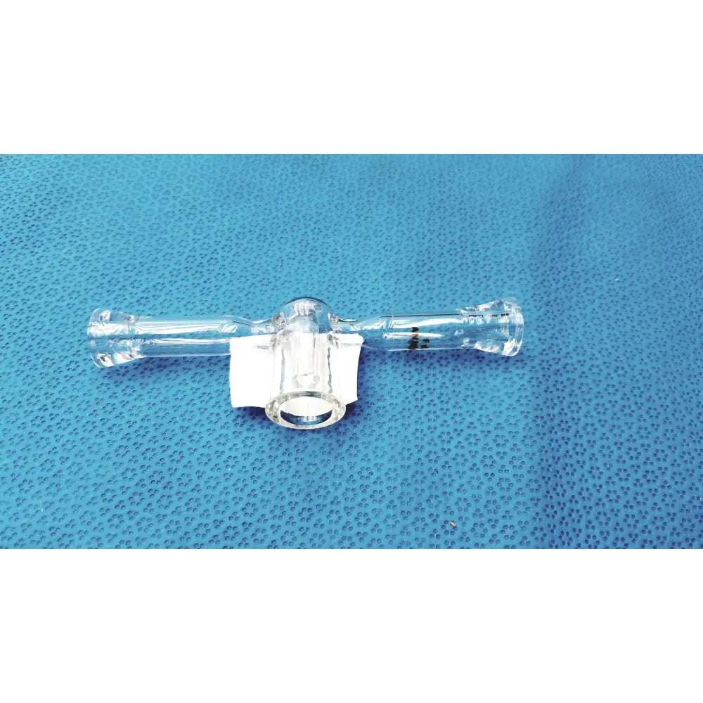 Clear glass spherical joint glass stopcock valve made of borosilicate with central connector and side ports for lab vacuum