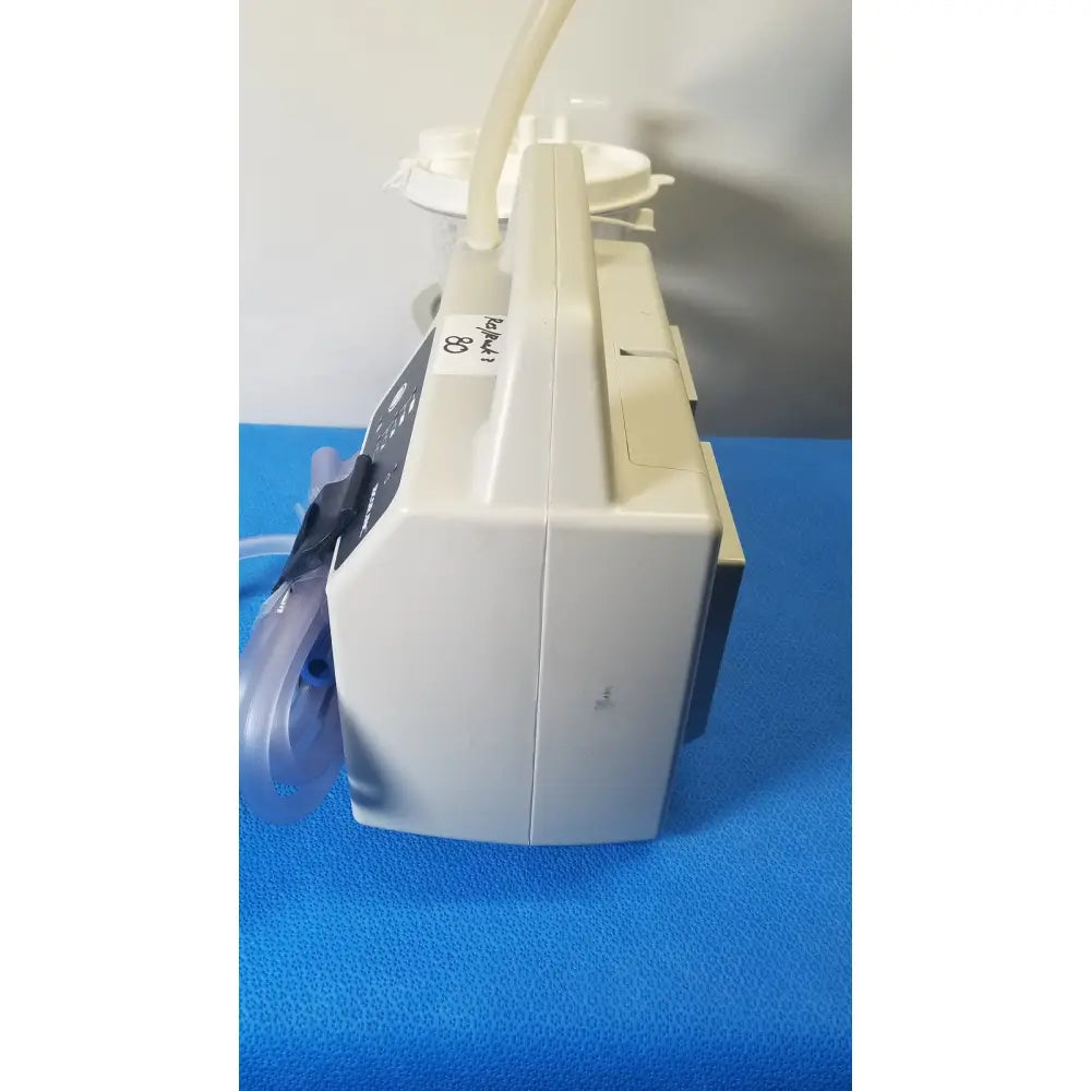 Beige sscor duet suction unit model 2314b with transparent tubing and control panel for medical suction use