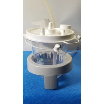 White and gray plastic sscor duet suction unit with clear measuring container model 2314b for medical use