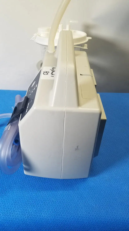 Beige sscor duet suction unit model 2314b with transparent tubing and control panel for medical suction use