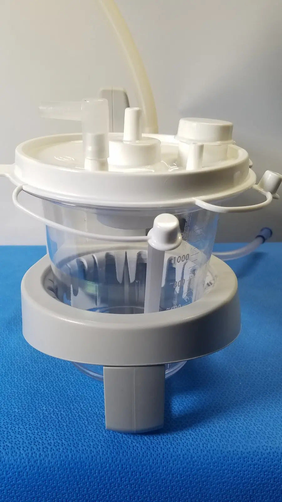 White and gray plastic sscor duet suction unit with clear measuring container model 2314b for medical use