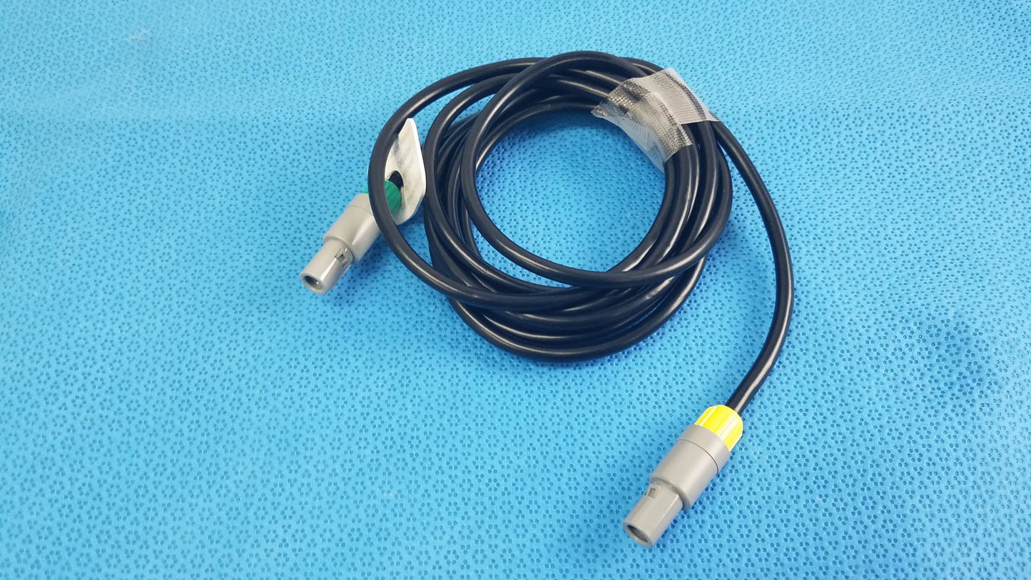 Black coiled catheter connection cable with gray connectors and yellow accent for reuse medical equipment by St Jude Medical
