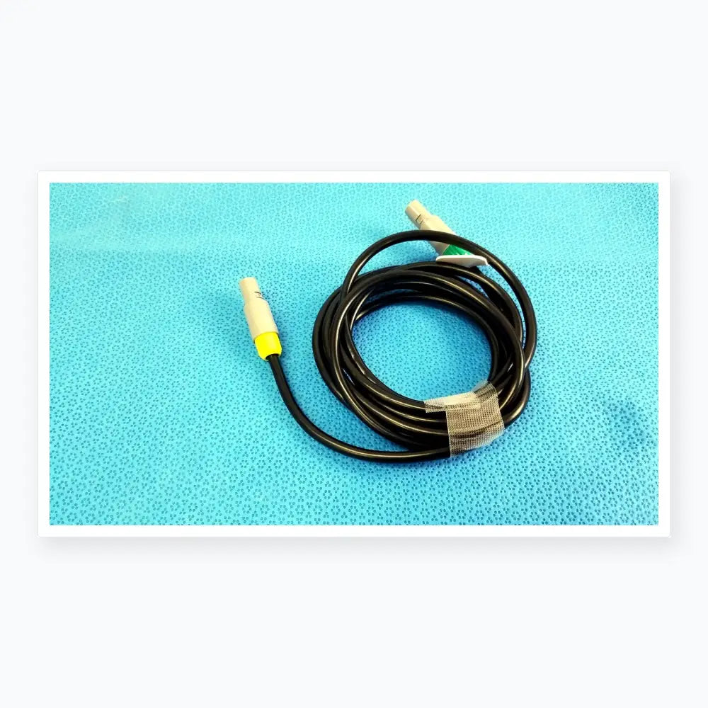 Black coiled St Jude Medical Ibi-85641 catheter connection cable with gray connectors and yellow accents for medical equipment reuse