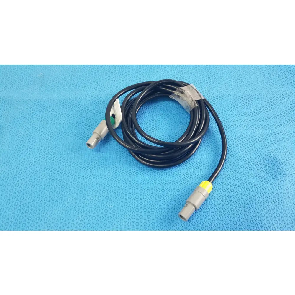 Black coiled catheter connection cable with gray connectors and yellow accent for reuse medical equipment by St Jude Medical