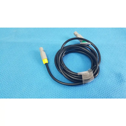 Black coiled St Jude Medical Ibi-85641 catheter connection cable with gray connectors and yellow accents for medical equipment reuse