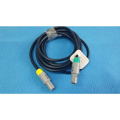 Black coiled medical equipment catheter connection cable with gray connectors and yellow green accents for reuse medical equipment