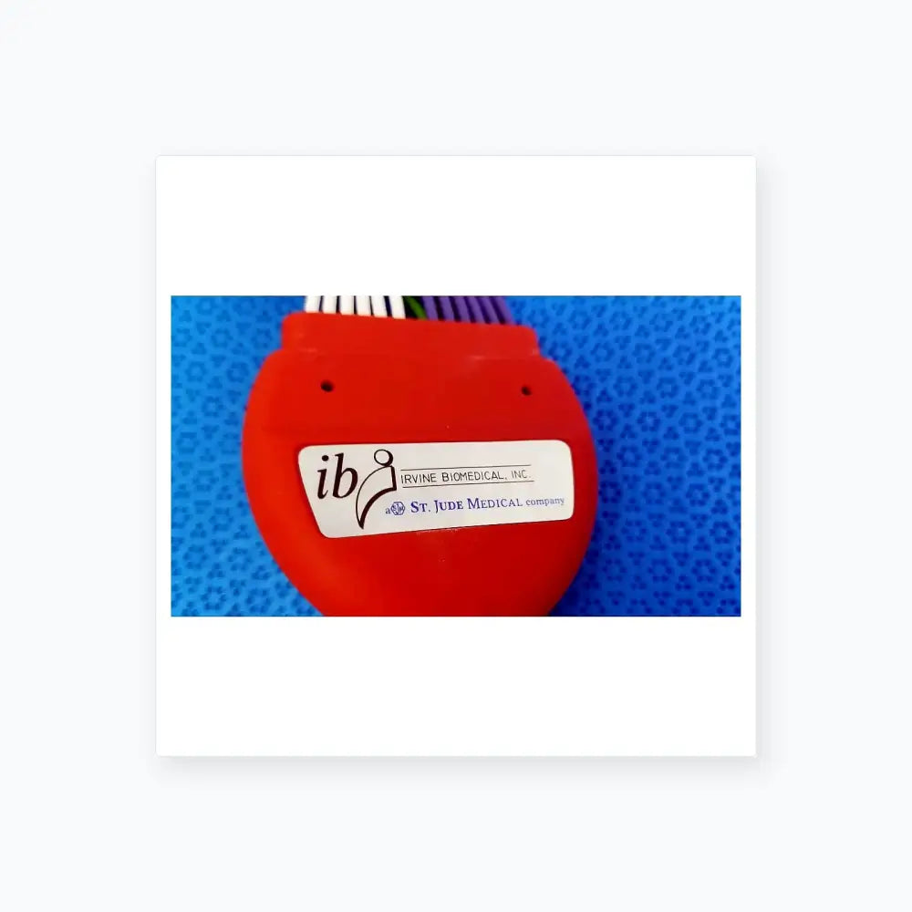 Orange plastic connecting cable with white label featuring ib logo from st jude medical for medical equipment use