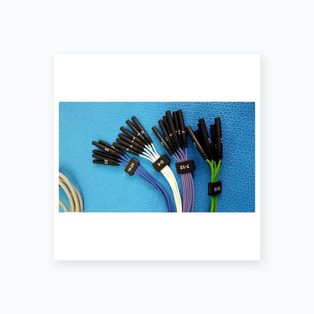 Black-capped color-coded jude medical connecting cable with labeled black plastic tags for medical equipment use