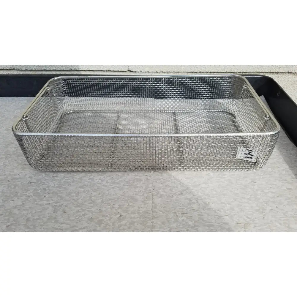 Rectangular stainless steel basket for sterilization case with mesh design, reinforced handles, and internal partitions