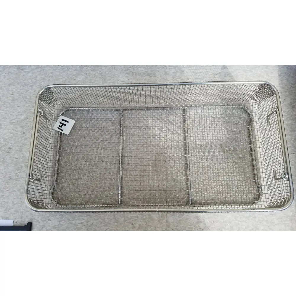 Rectangular stainless steel basket with reinforced handles and internal partitioning for sterilization case use