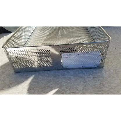 Rectangular stainless steel instrument sterilization basket tray with solid side panel and perforated sides with label