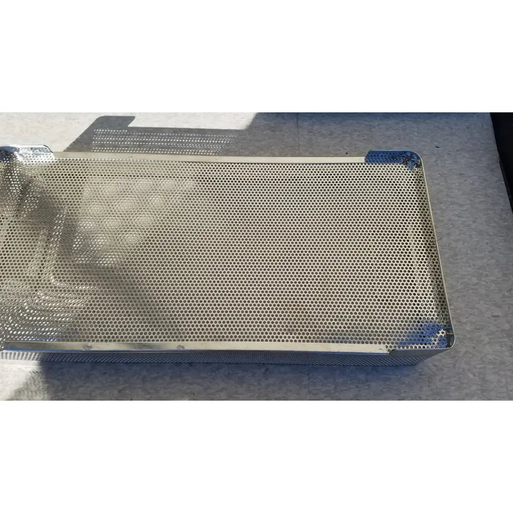 Rectangular stainless steel instrument sterilization basket tray with perforated surface and reinforced edges
