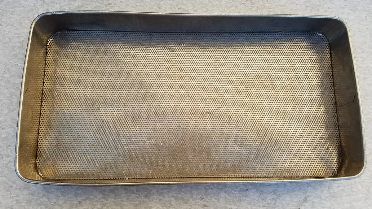 Rectangular stainless steel sterilization basket tray with a perforated mesh interior surface for steel sterilization