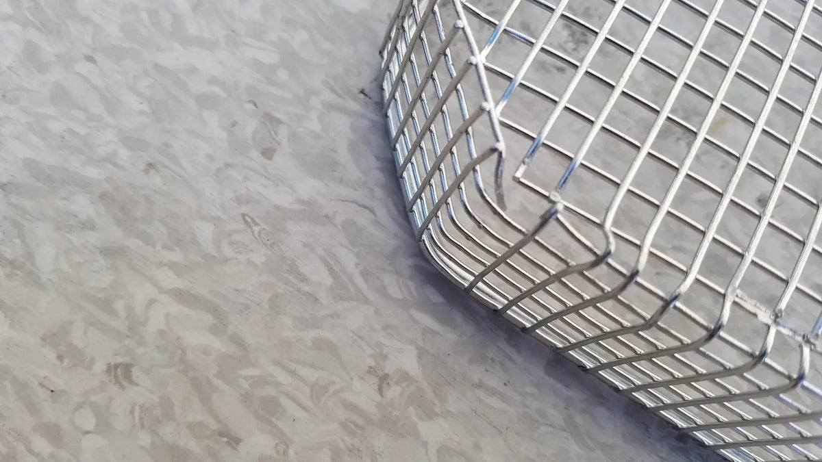 Silver curved cylindrical wire mesh basket made of stainless steel for sterilization surgical cases use