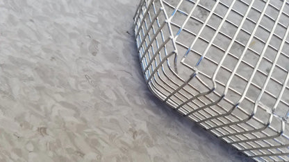 Silver curved cylindrical wire mesh basket made of stainless steel for sterilization surgical cases use