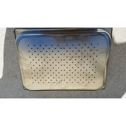 Stainless steel vollrath perforated tray with rectangular shape and rounded corners for sheboygan tray case 6127