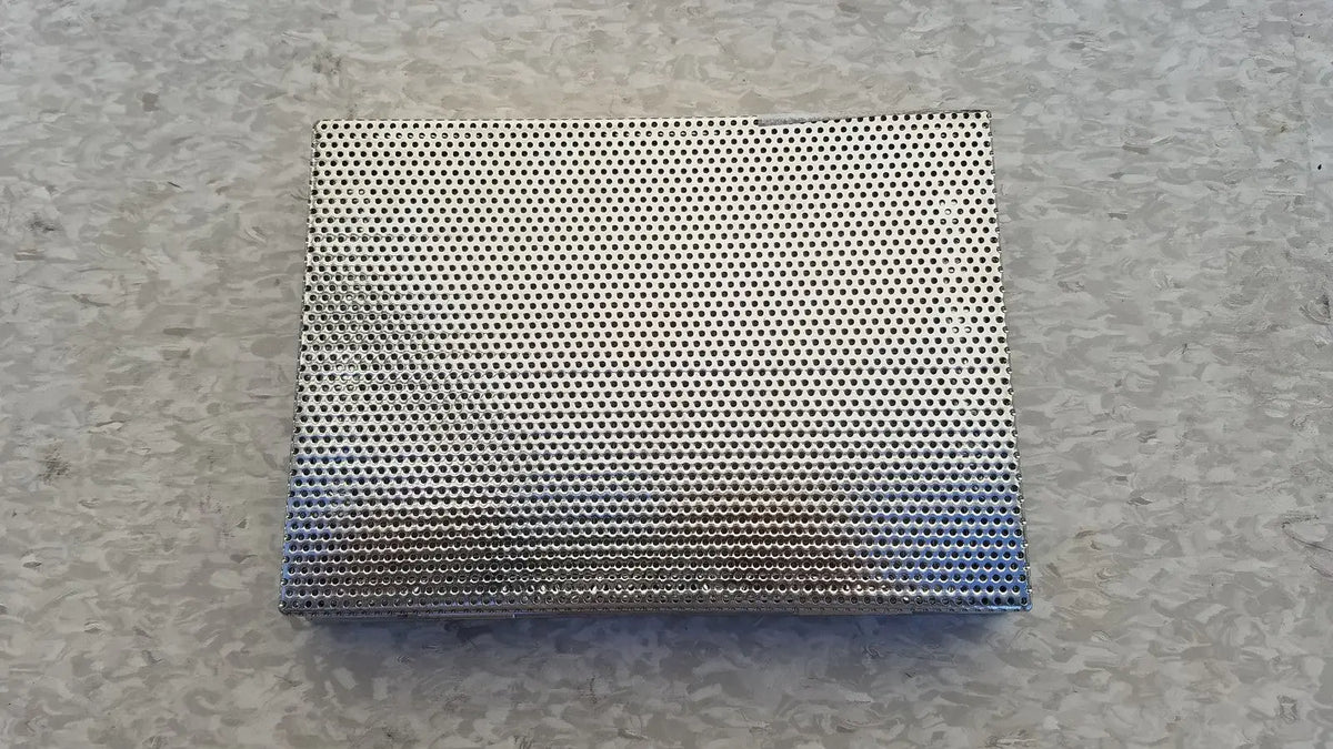 Stainless surgical instrument box with lid featuring a silver perforated metal panel and gradient blue tint bottom edge
