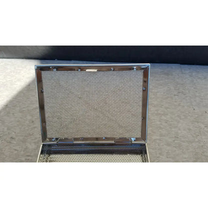 Stainless surgical instrument box with lid featuring a silver perforated metal panel and gradient blue tint bottom edge