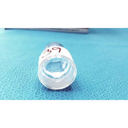 Clear glass test tube with white label marked 39 in red ink featuring standard taper hollow ground glass stopper plug