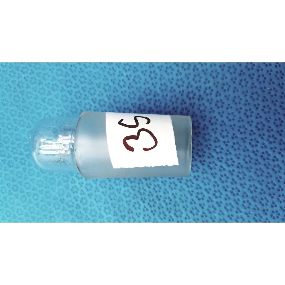 A translucent frosted glass vial with a standard taper no 29 brown label and a clear borosilicate glass hollow stopper