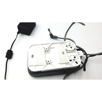White plastic aquarium air pump with black base and power cord shown with stanley healthcare m200 nurse call unit extras