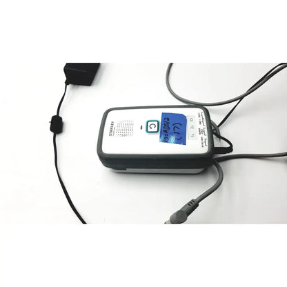 Stanley healthcare m200 nurse call unit with extras featuring handheld barcode scanner with black and white casing and connected cables
