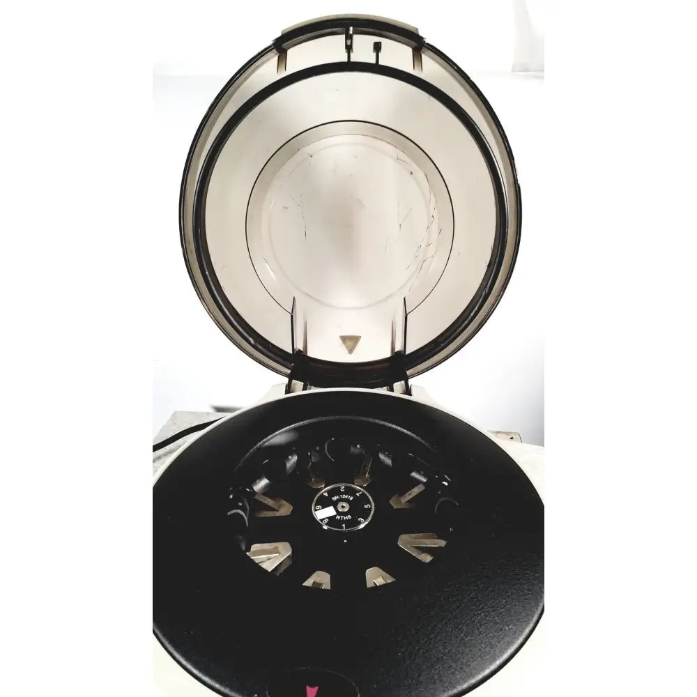 Black statspin express m510 high-speed horizontal centrifuge with transparent lid and metallic rotor for lab use