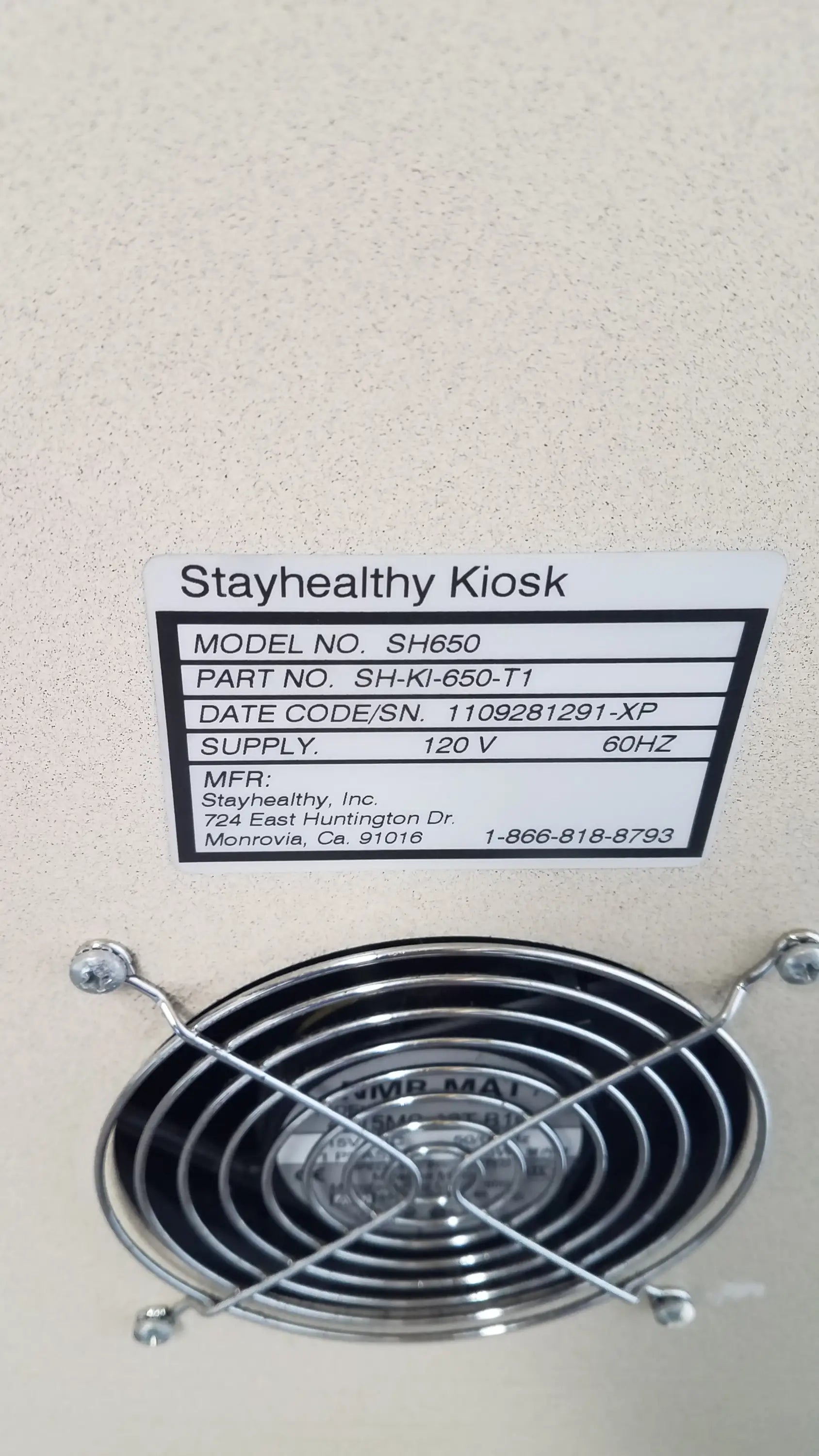 Silver metallic fan grille with circular design and four mounting screws on the back of stayhealthy sh650 health screening kiosk