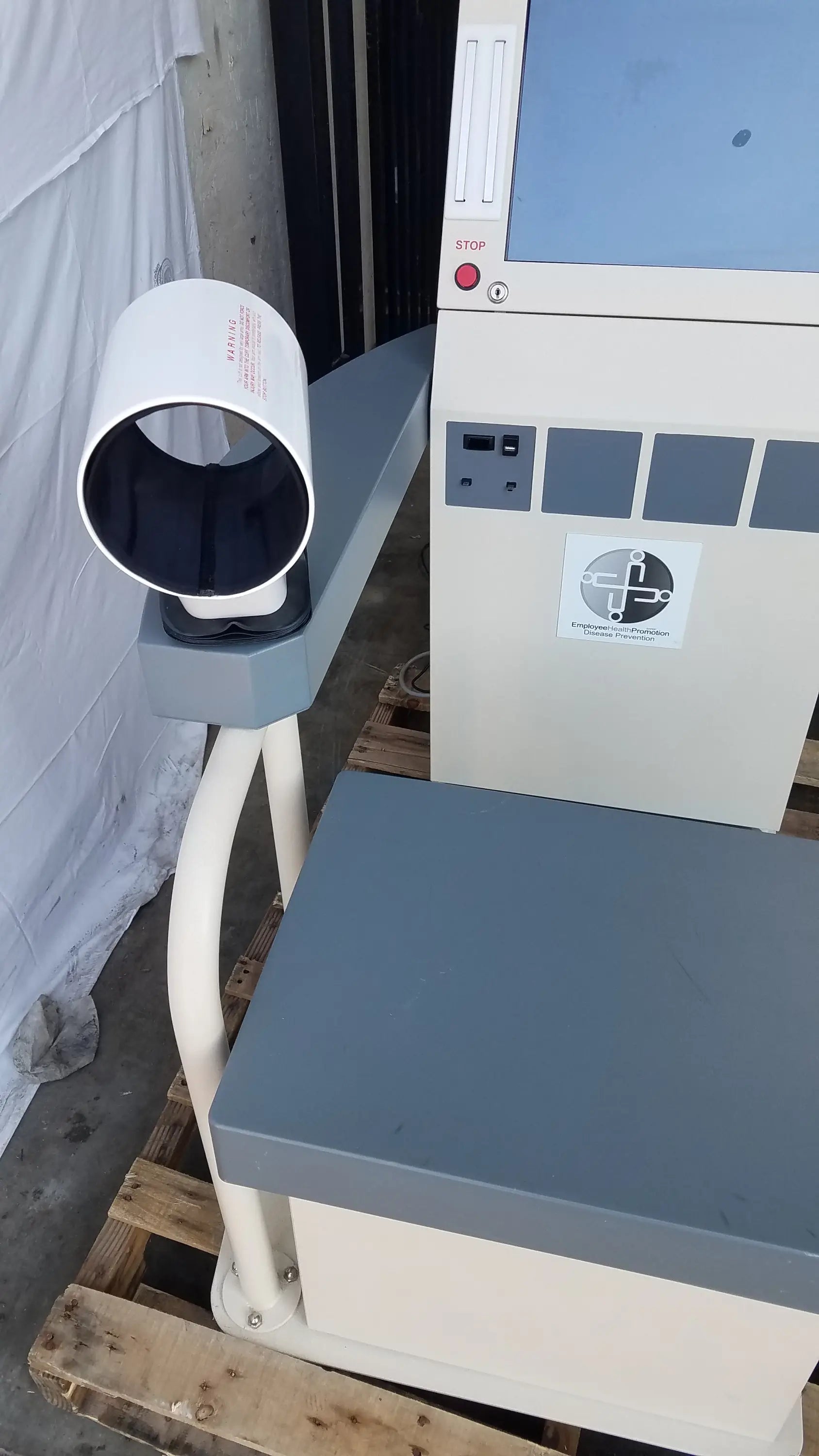 White cylindrical scanner arm mounted on gray and beige stayhealthy sh650 health screening kiosk for self-service screening