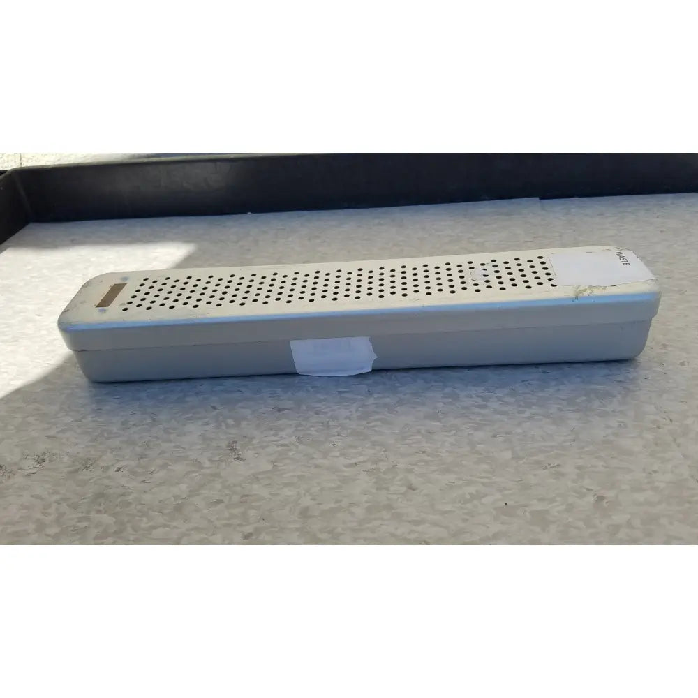 Silver rectangular steel healthcare equipment medical sterilization case tray with perforated top and rounded edges
