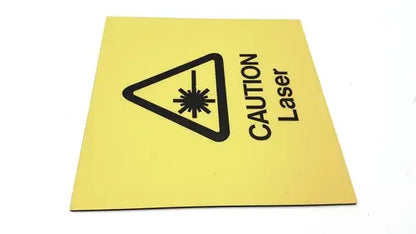 Yellow square fun wall sign with black caution laser symbol warning of laser zone wall sign ahead