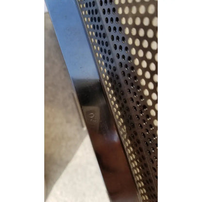 Shiny metallic edge with perforated pattern and engraved 02 marking on sterilization case tray for surgical instruments