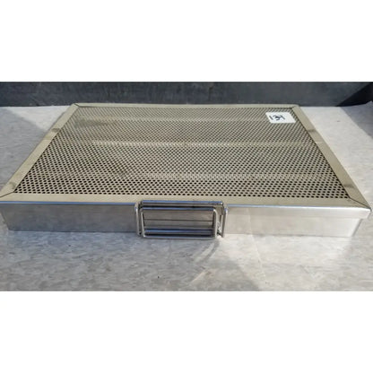 Stainless steel sterilization case tray with solid metal frame and integrated handle for surgical instruments