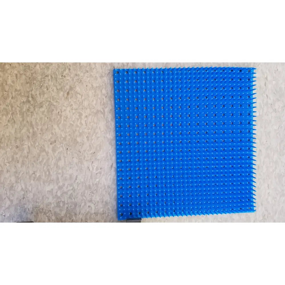 Bright blue plastic pegboard with raised bumps and holes for sterilization case silicone mat reuse medical use