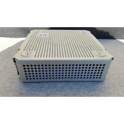 Beige sterilization case with perforated metal sides and top, small corner latches, and silicone mat for reuse medical use